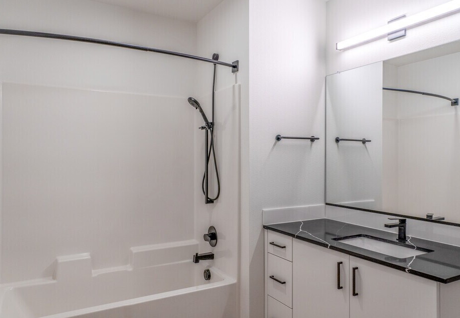 Photo of a bathroom with a shower/tub combo