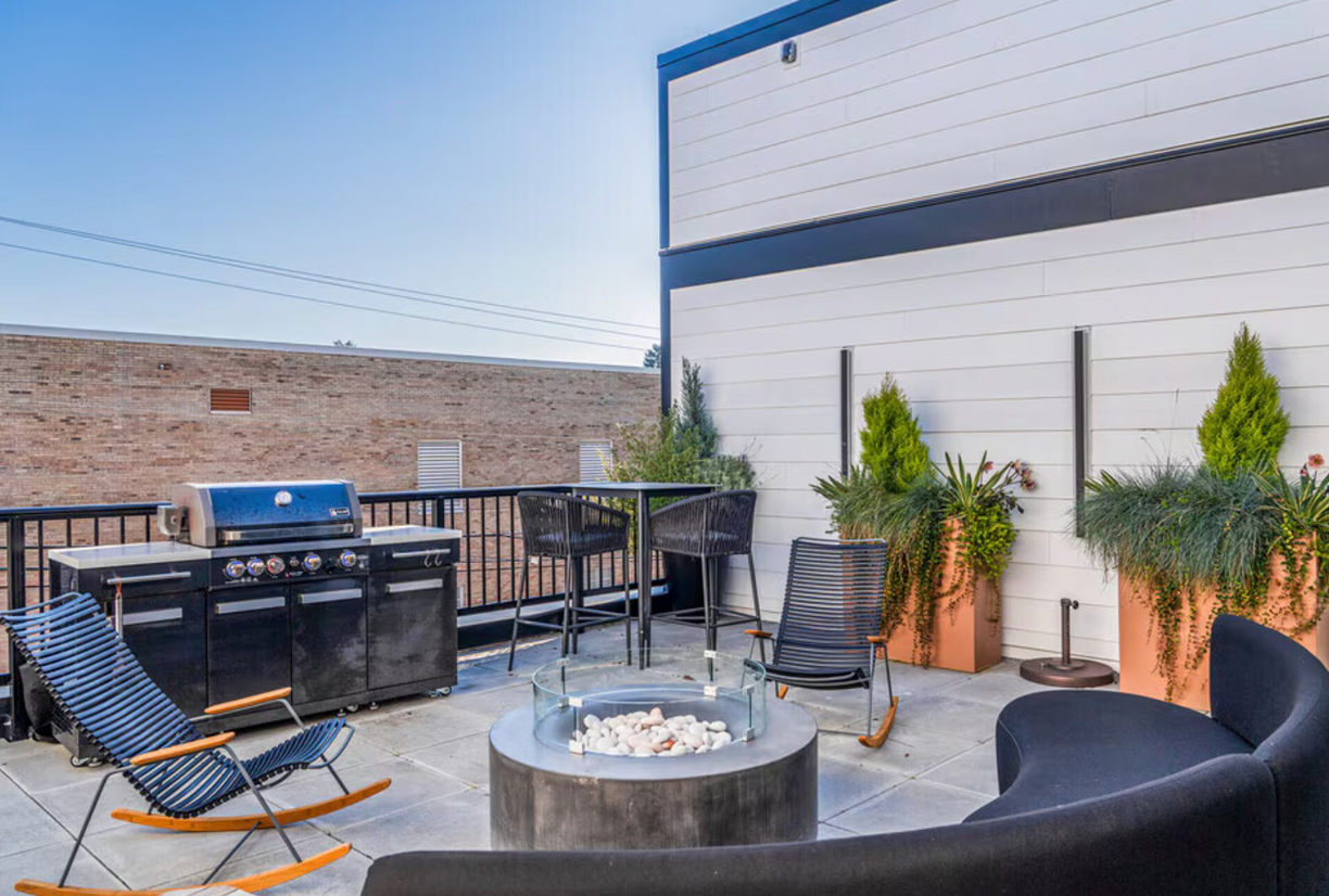 Photo of a rooftop grill-and-chill area