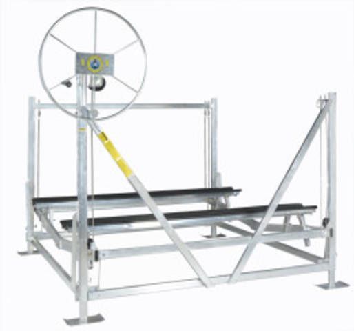 A boat lift with a wheel on top of it
