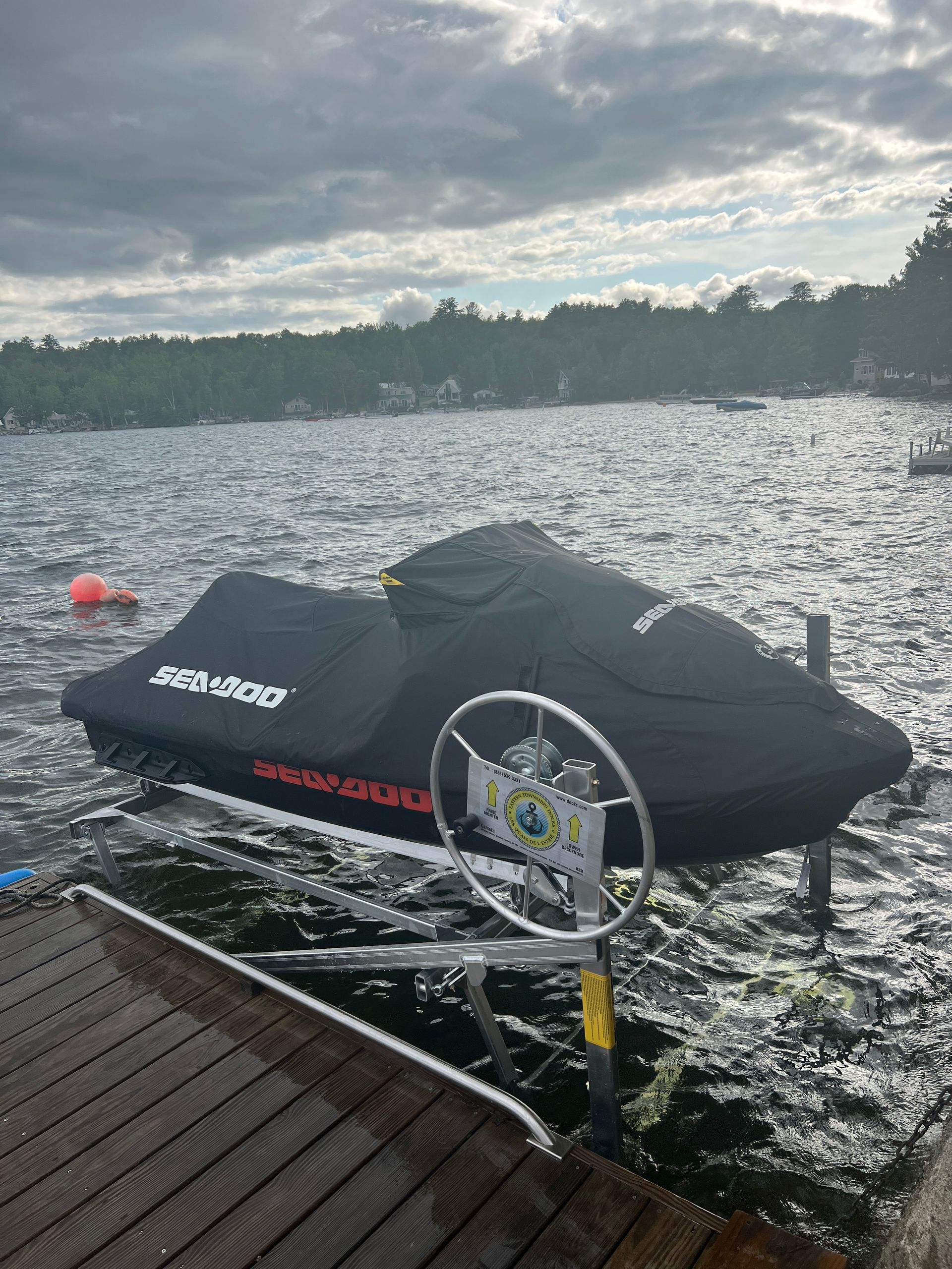 A jet ski is docked at a dock in the water.