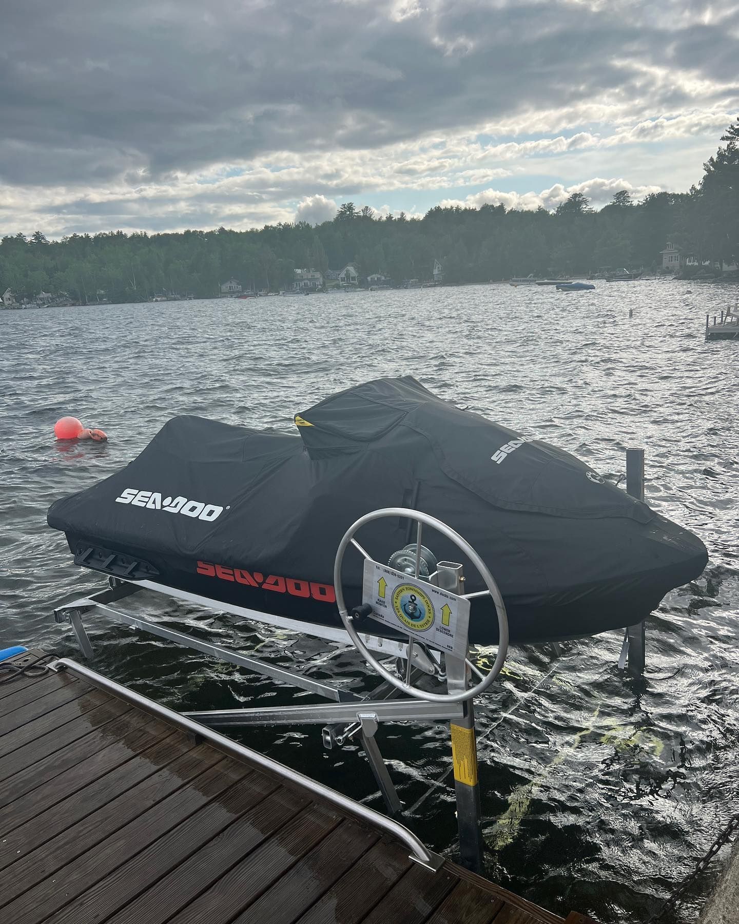 A jet ski is sitting on a dock in the water.
