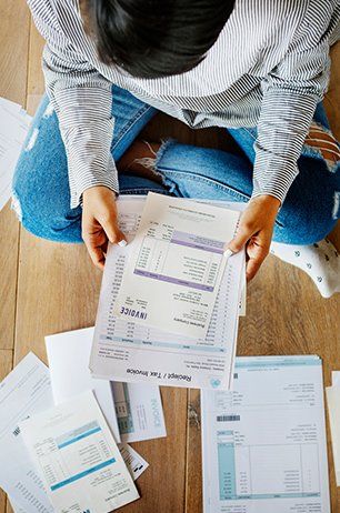 Debt Collector — Woman Holding Payment Slip in Columbus, OH