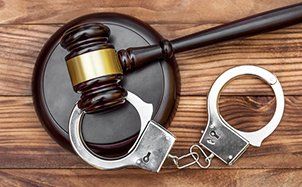 Columbus Criminal Defense Attorney — Gavel and handcuff in Columbus, OH