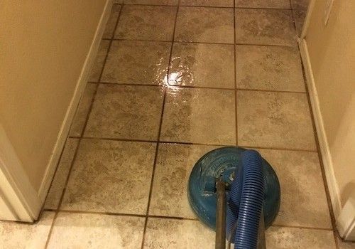 A close up of a carpet with a pattern on it.