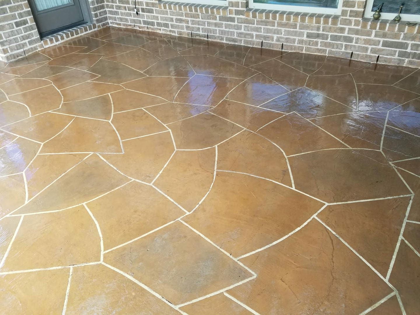 Brown and white patterned concrete patio.