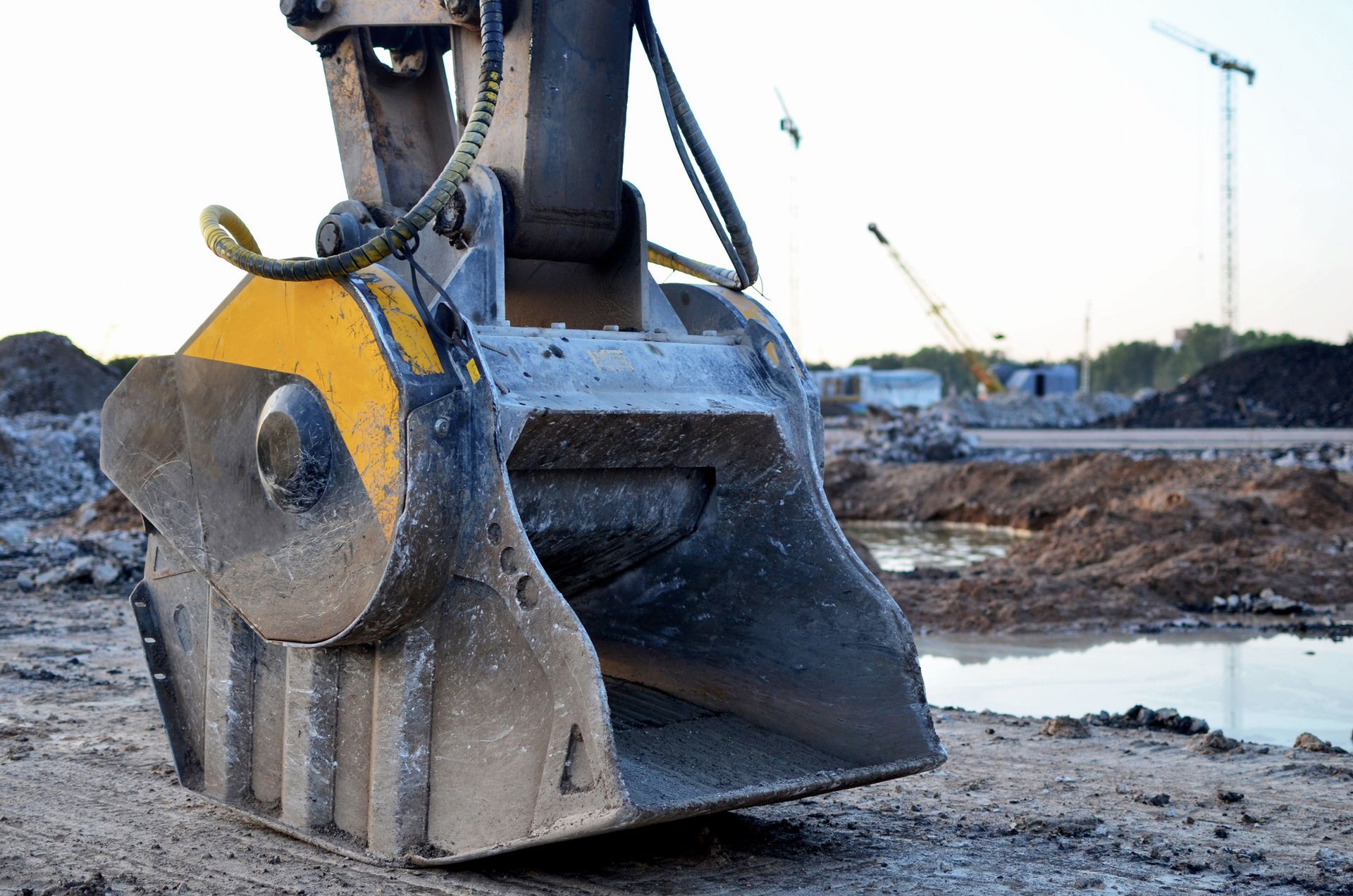 A close up of a bulldozer bucket on a construction site.