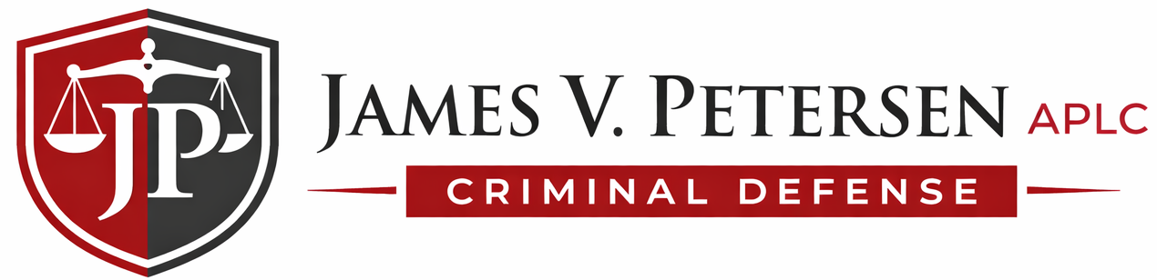 Logo for James V. Petersen APLC: a shield with scales of justice and the letters JP, next to the firm's name.