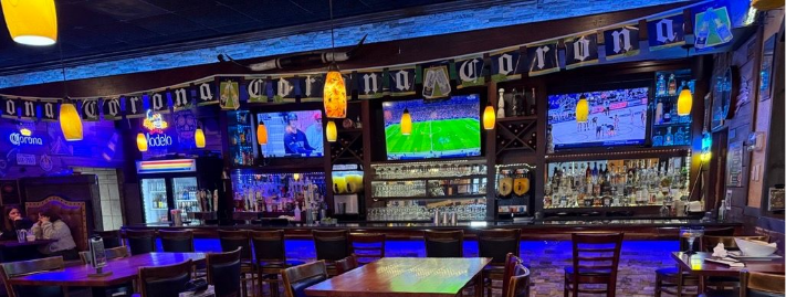 Two cocktails on a bar