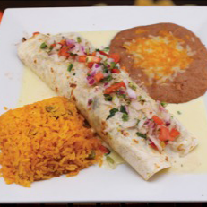 Burrito with pico de gallo, rice, and refried beans on a white plate.