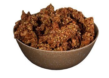 Bowl of homemade granola, various shades of brown and tan.