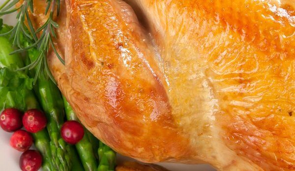 Roasted turkey breast with asparagus, cranberries, and rosemary.