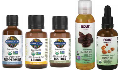 Five bottles of essential oils: peppermint, lemon, tea tree, jojoba, and argan.
