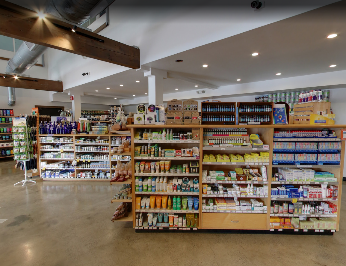 Store shelves stocked with a variety of personal care and health products, viewed from a slightly elevated angle.
