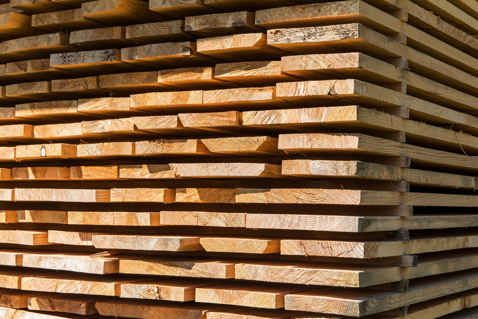A timber stack air-drying outdoors.