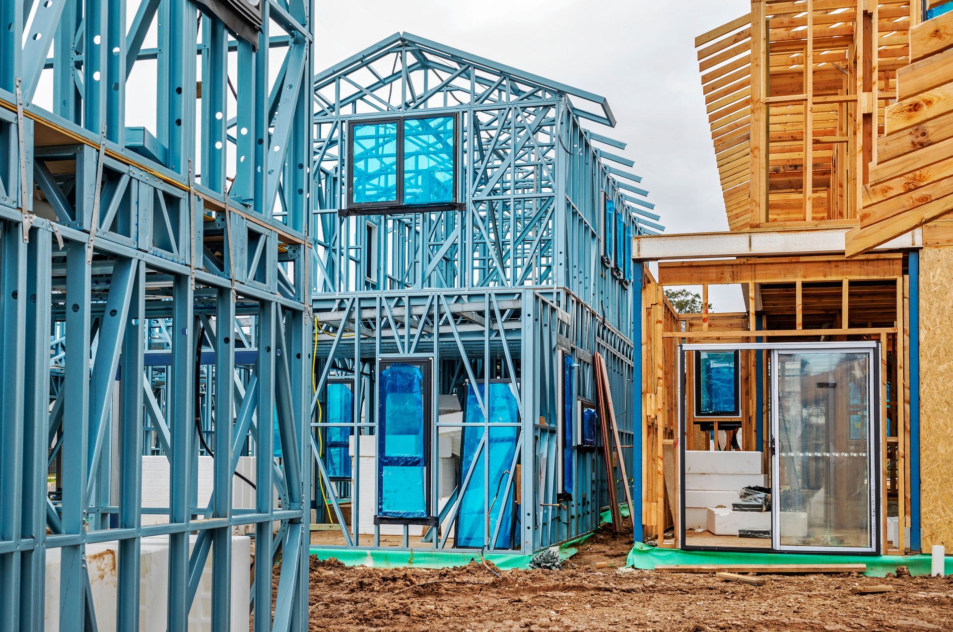 Building construction site, new housing development, metal and timber frame.