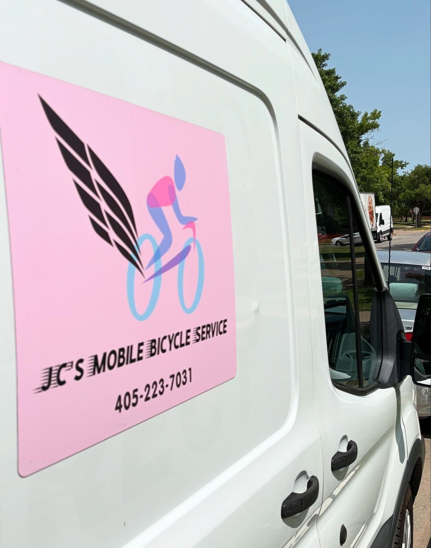 White van with a pink sign: