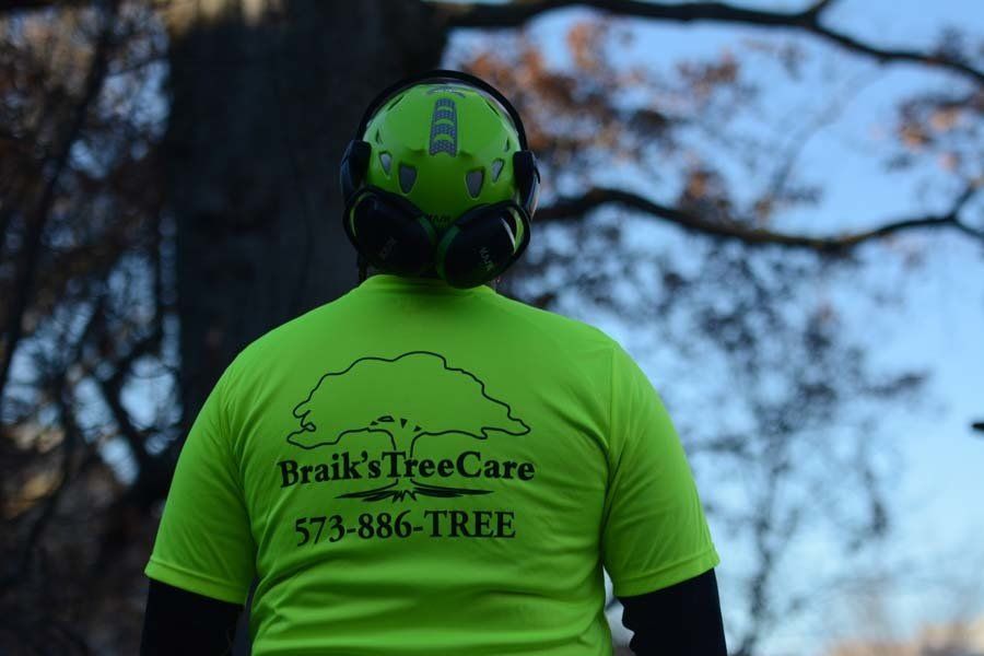 Find Braik’s Tree Care Staff in Their Recognizable Green Uniforms Trimming Trees in Mid-MO.