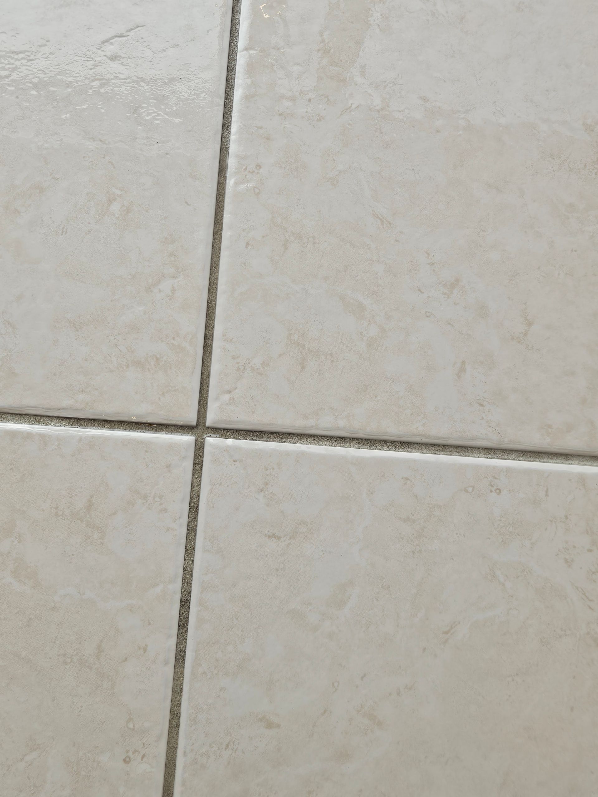 Four white tiles that have been cleaned - Pinnacle Carpet Cleaning in Central Coast, NSW