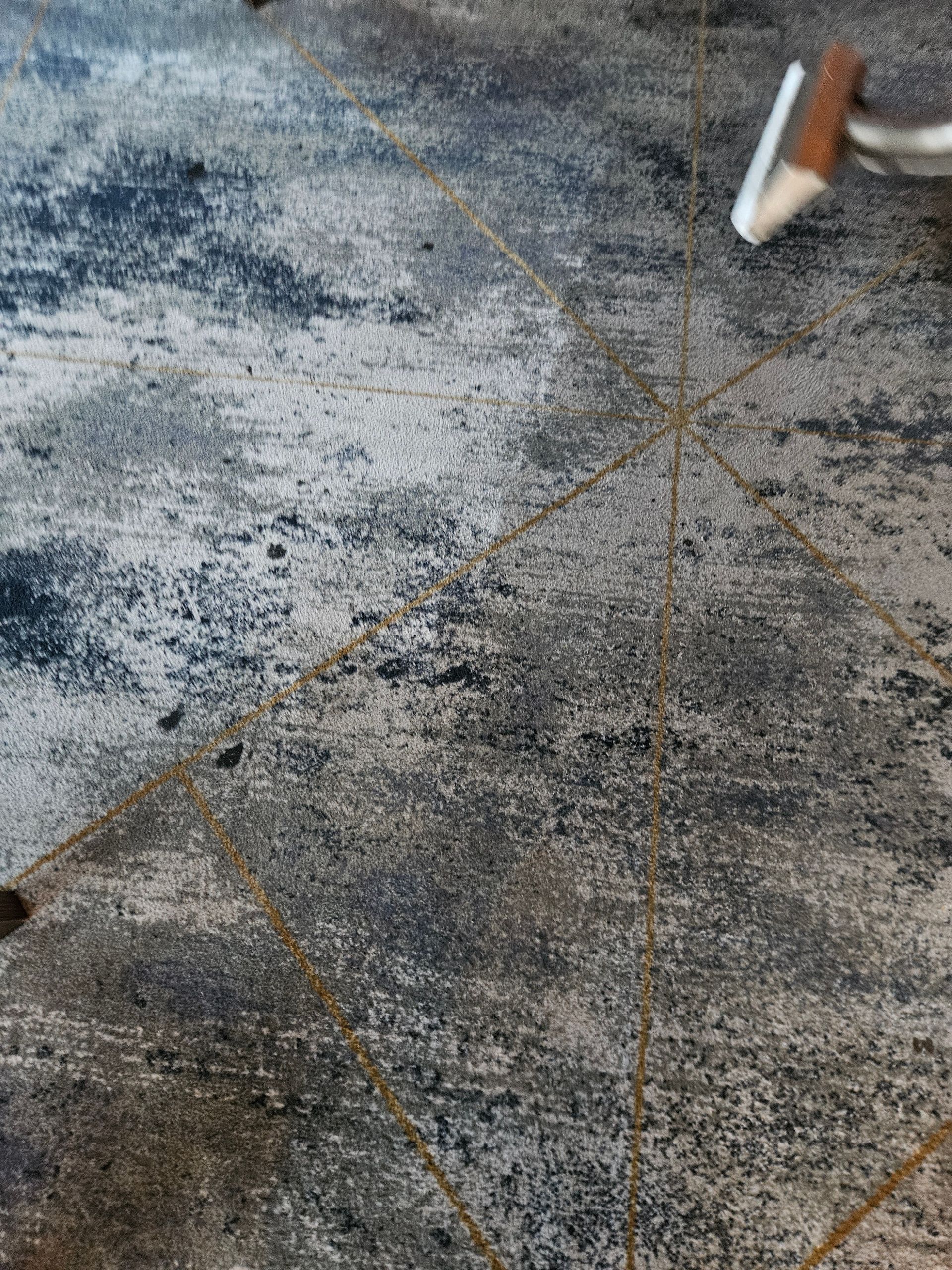 A vacuum cleaner is cleaning a dirty rug on the floor. — Pinnacle Carpet & Upholstery Cleaning In Central Coast, NSW