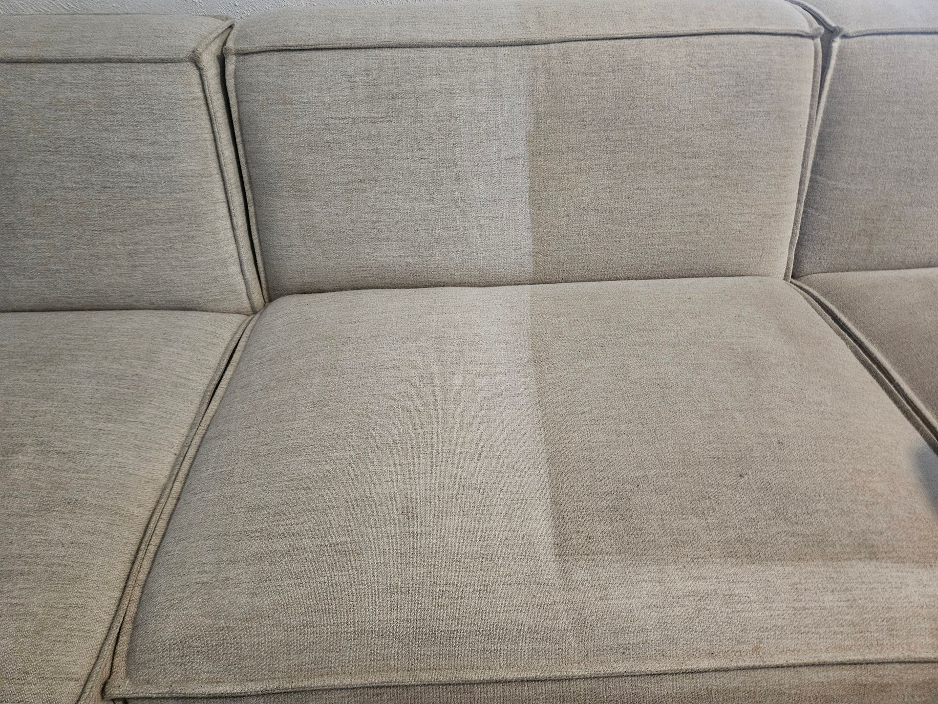 Before and after image of a couch being cleaned — Pinnacle Carpet & Upholstery Cleaning In Central Coast, NSW