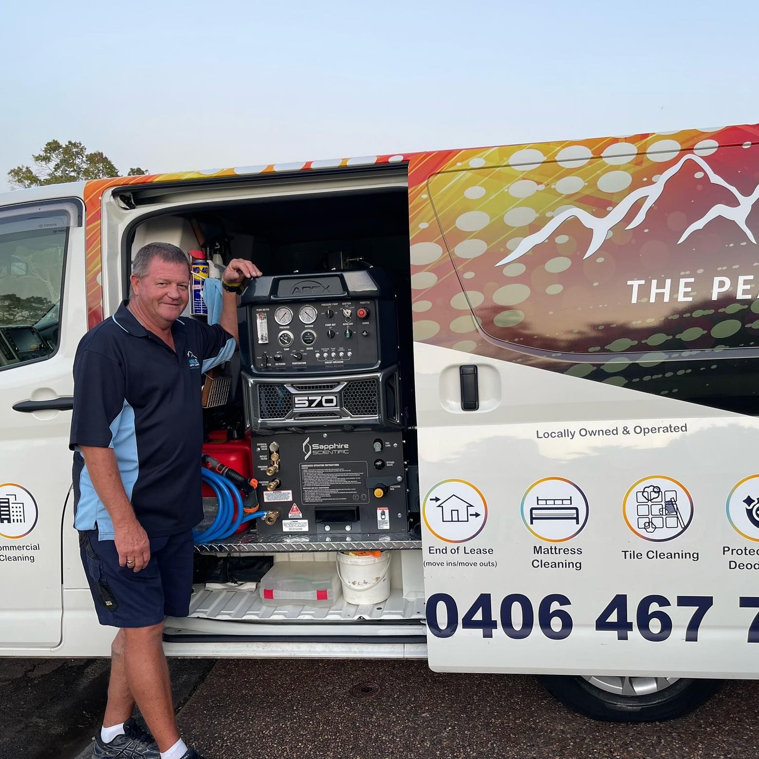 A Man Is Standing In Front Of A Van — Pinnacle Carpet & Upholstery Cleaning In Wyong, NSW