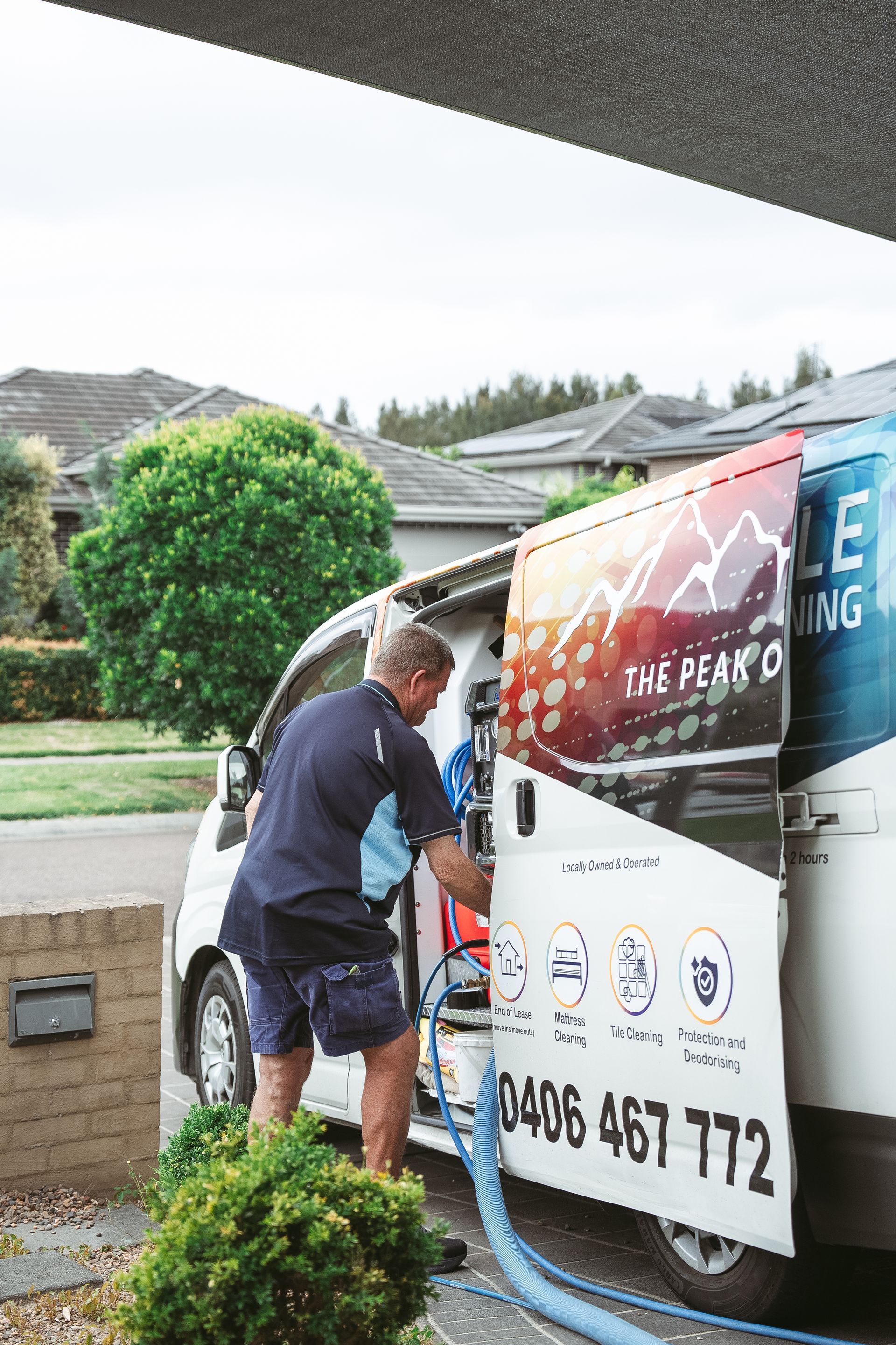 A man is loading a vacuum cleaner into a van. — Pinnacle Carpet & Upholstery Cleaning In Wyong, NSW