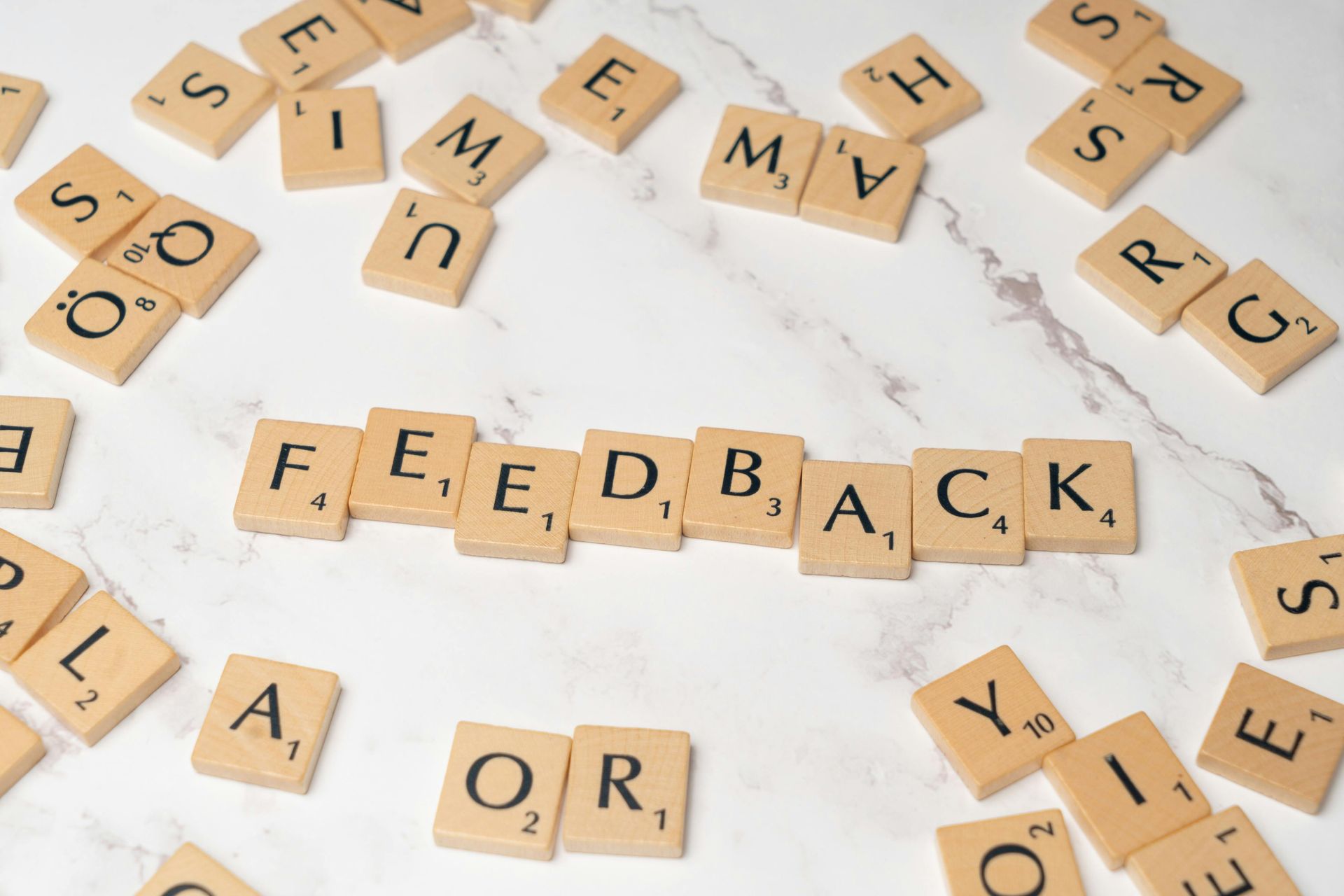 Scrabble letters laid out to spell feedback