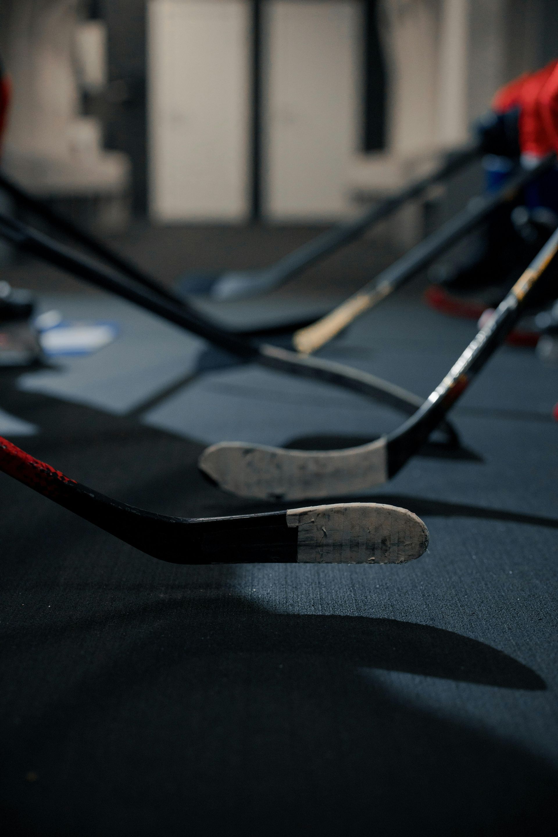 Hockey locker room with hockey sticks