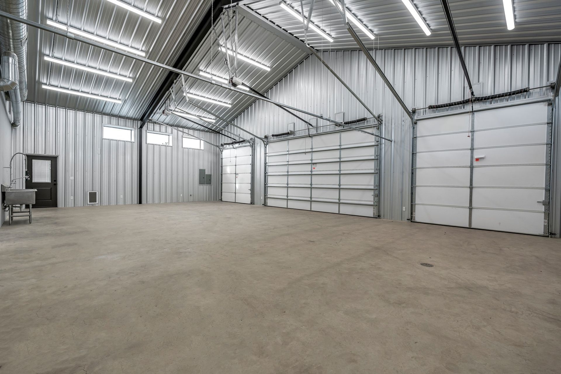 Two men are loading boxes into a van.
