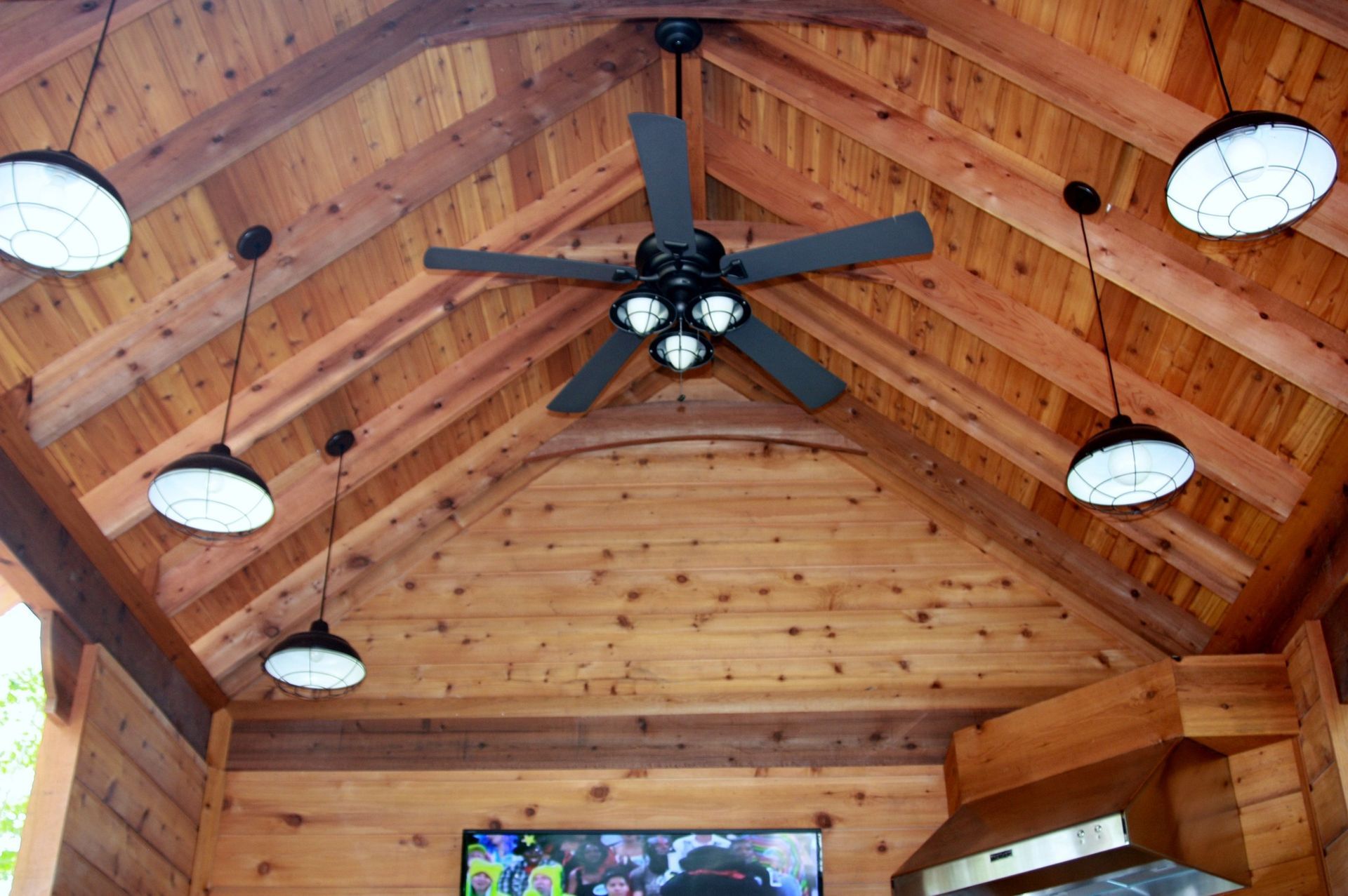 A man wearing a mask is carrying a cardboard box into a van.