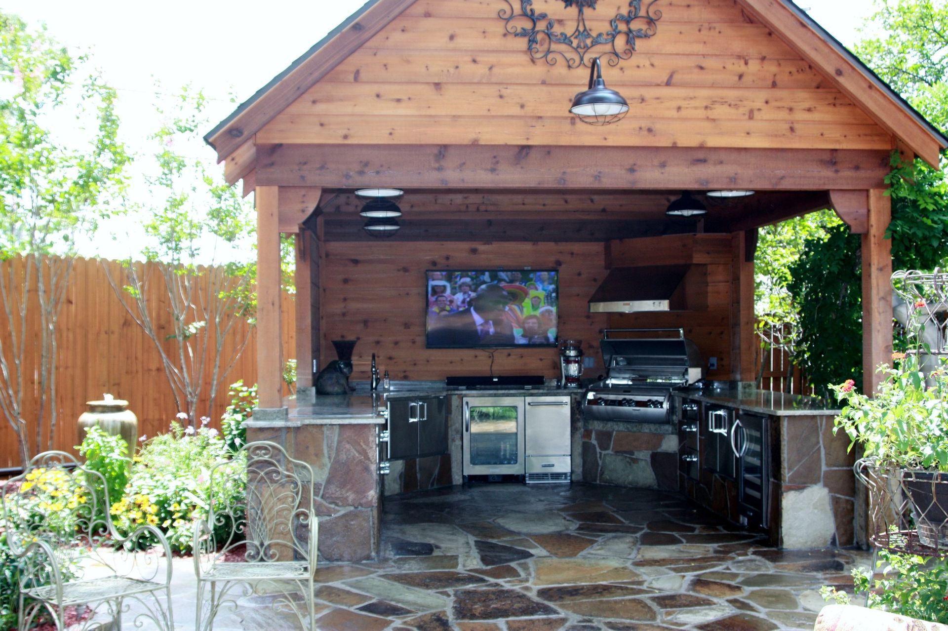 A large wooden structure with a kitchen inside of it