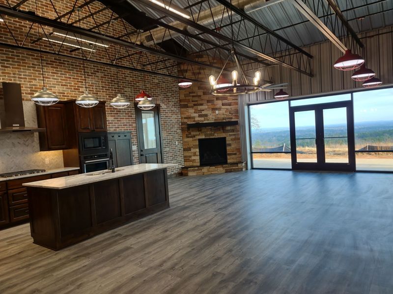 A man is loading boxes into the back of a van.