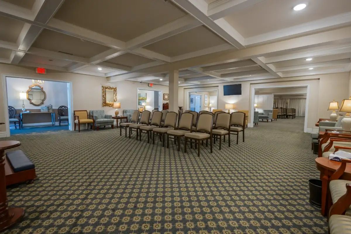 Interior view of a funeral home with chairs arranged for a service.