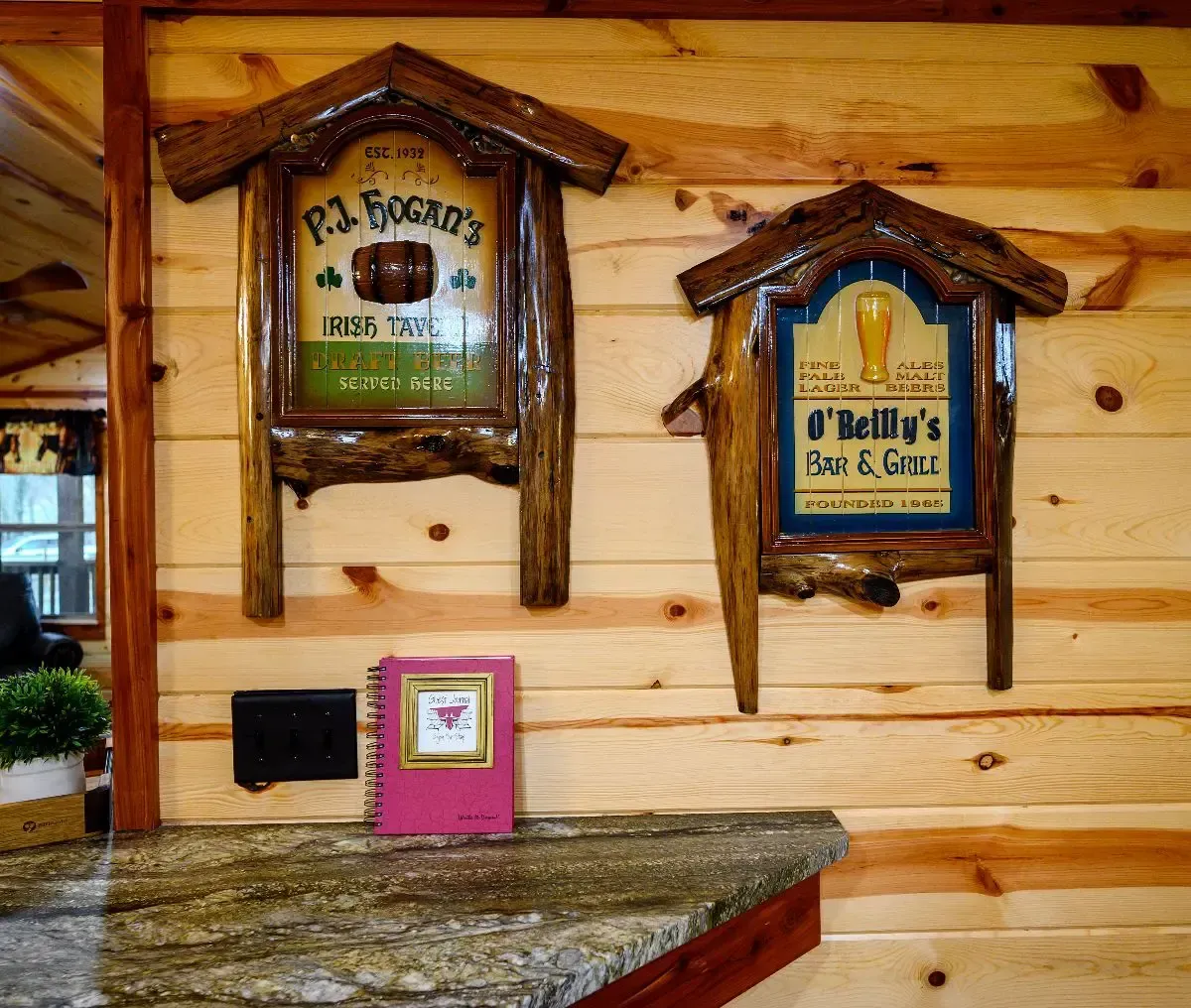 Two rustic, wood-framed signs for 