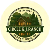 A circular logo for Circle K.J. Ranch in Broken Bow, OK, featuring a cabin, mountains, and trees in green and cream tones.