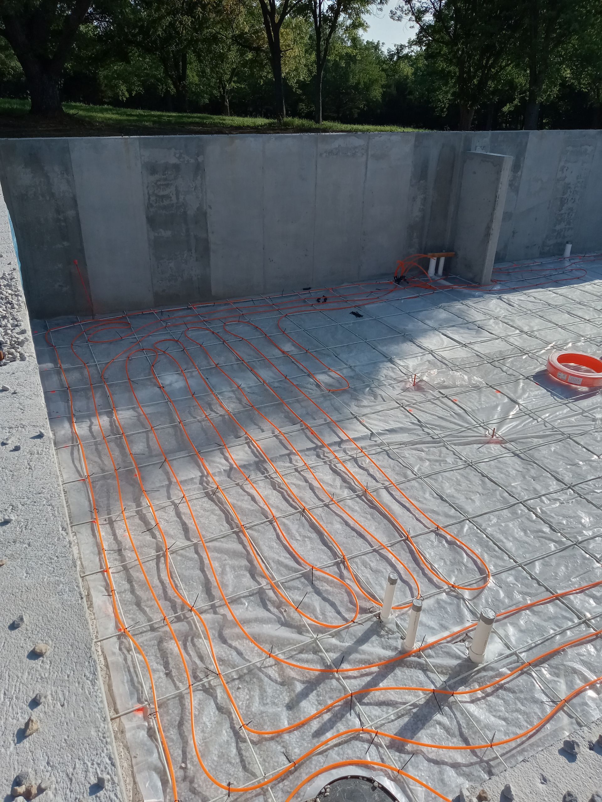 Installation of radiant floor heat in the basement of new construction.