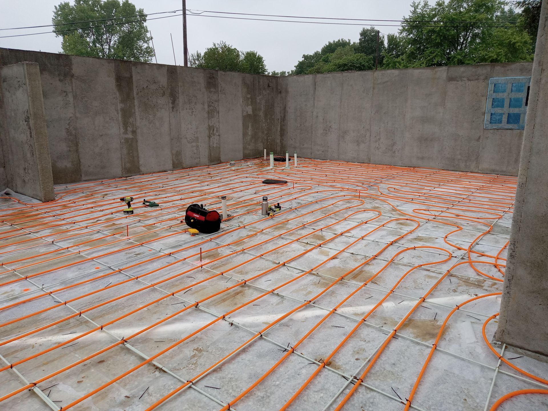 Installation of radiant floor heat in the basement of new construction.