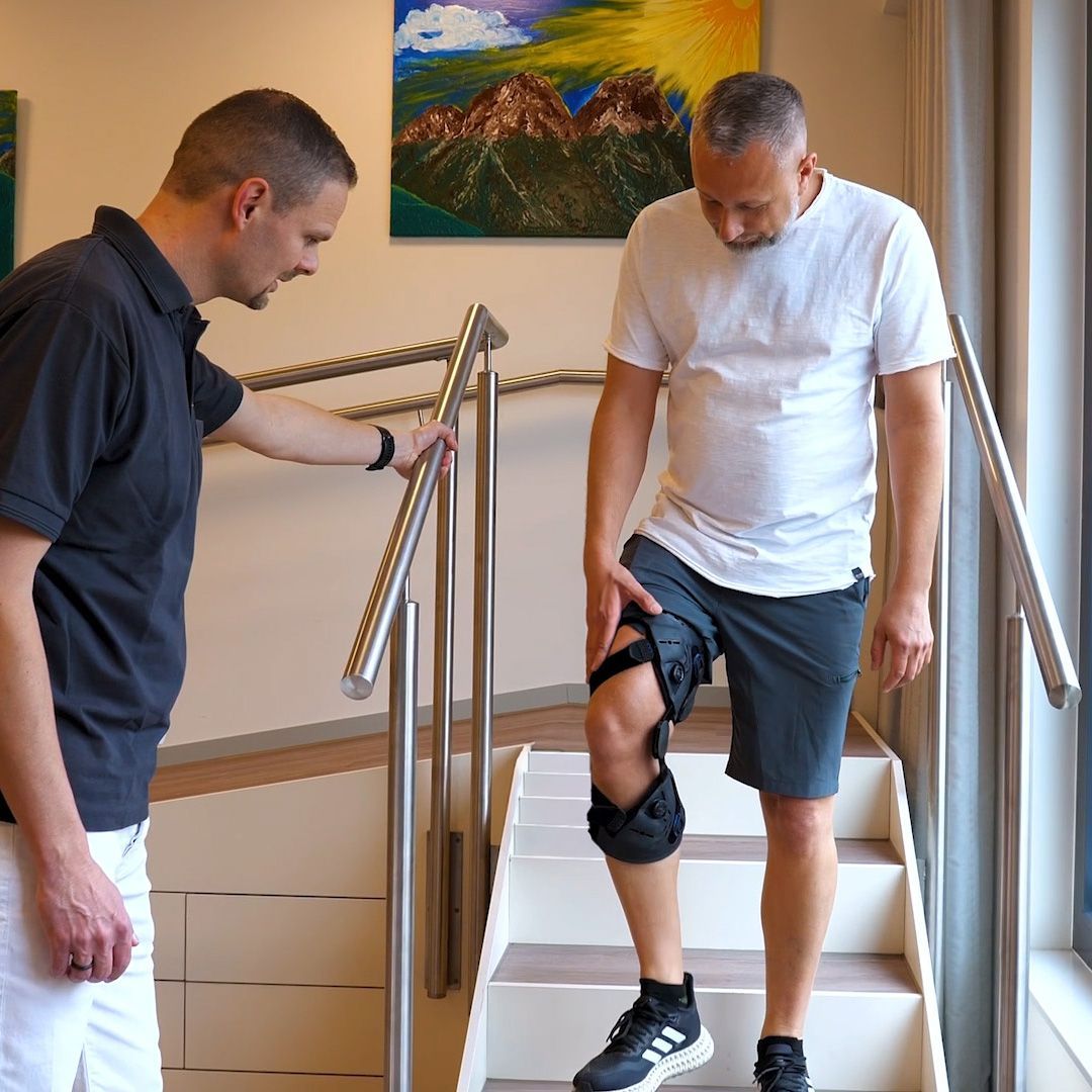 A Man is Learning To Walk With A Knee Brace — Gall Bros Medical in Robina, QLD