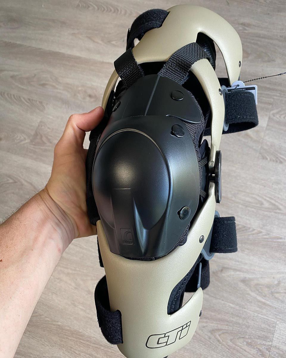 A Person is Holding a Knee Pad — Gall Bros Medical in Robina, QLD