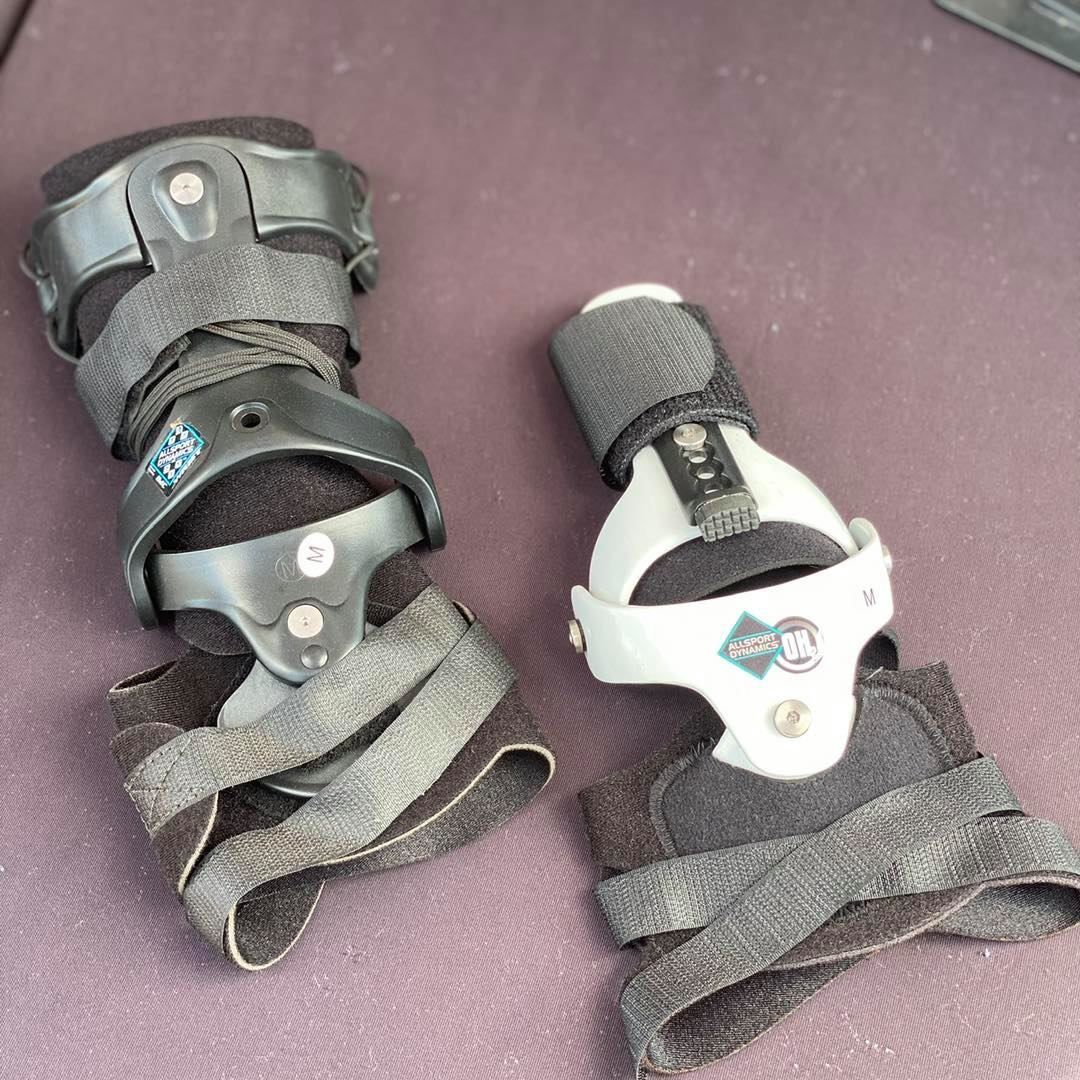 A Pair of Wrist Braces on a Purple Surface — Gall Bros Medical in Robina, QLD