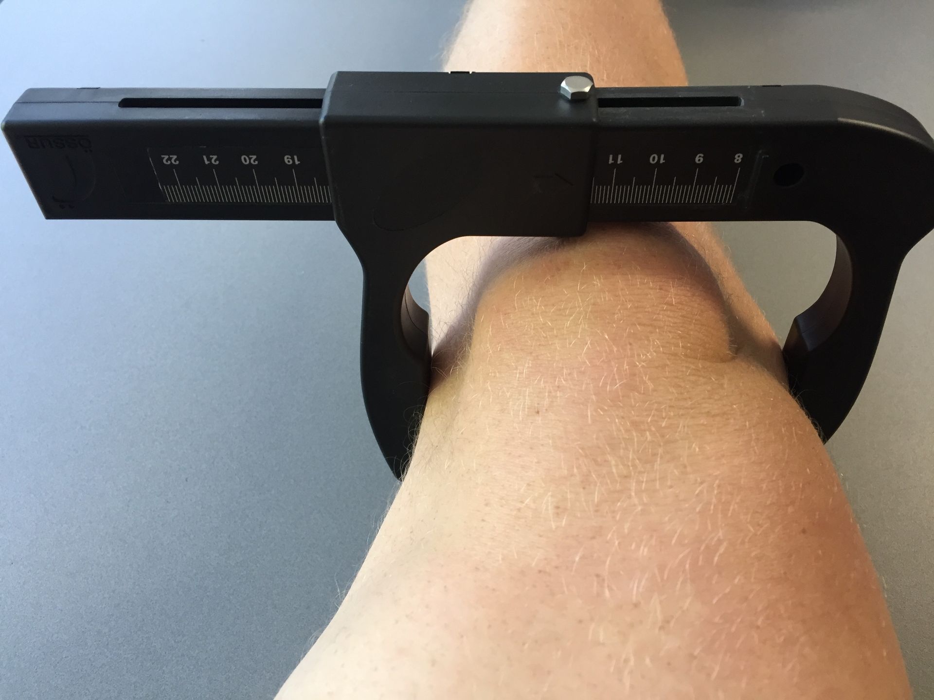 A Man Wearing a Black Elbow Brace With the Word Delta on It — Gall Bros Medical in Robina, QLD