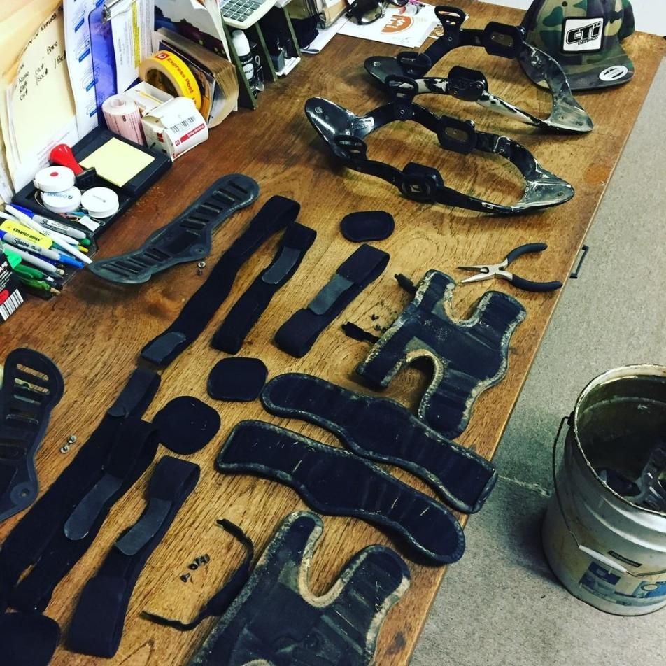 Protective Motorcycle Gear Laid Out on a Wooden Table — Gall Bros Medical in Robina, QLD