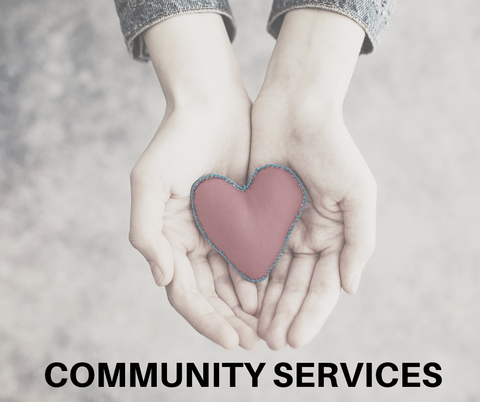Hands holding a pink heart above the words “COMMUNITY SERVICES”