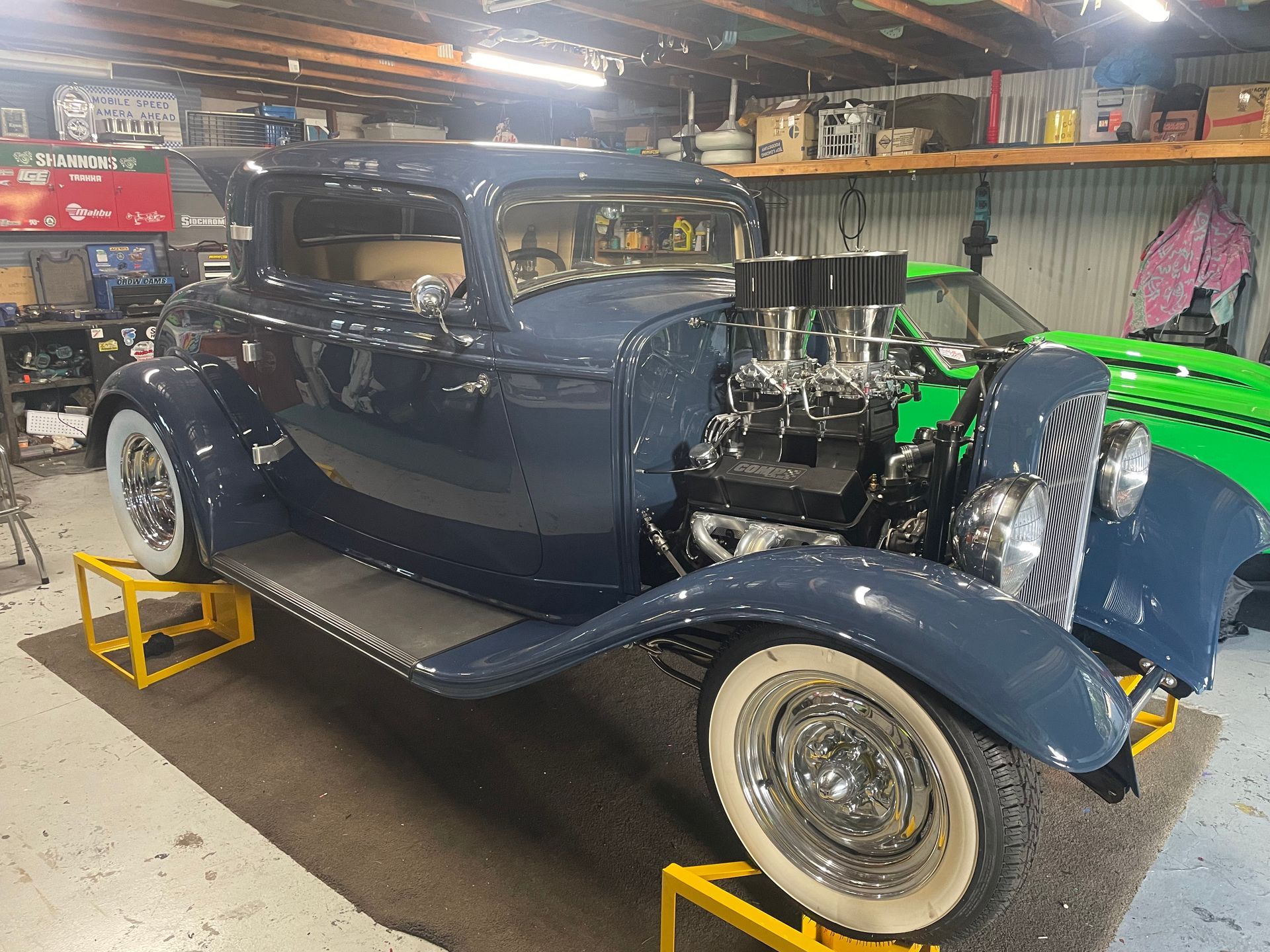 A Car Battery Is Being Charged With Jumper Cables — REM Auto Electrics In Cardiff, NSW