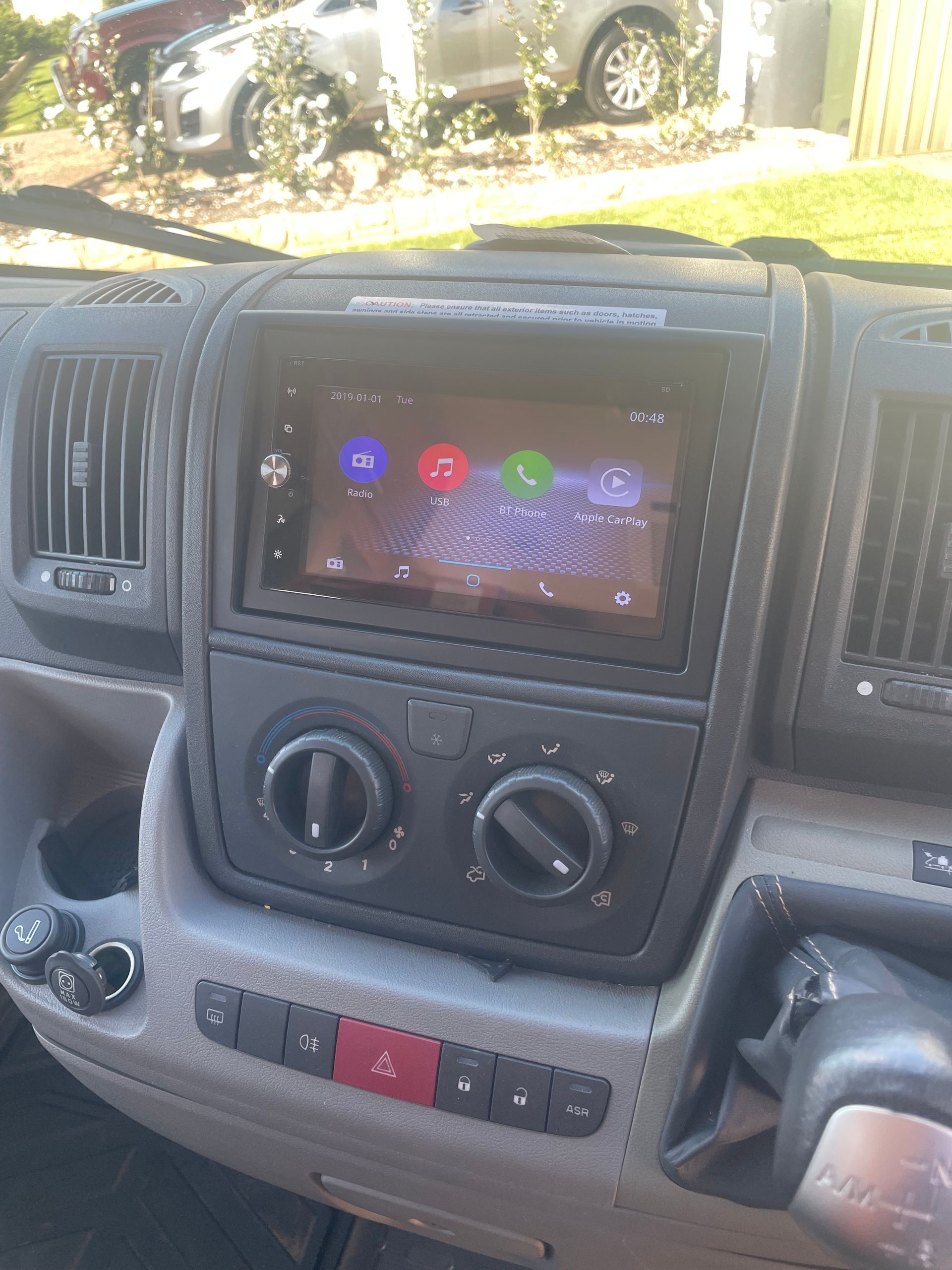 A Person Is Working On A Fuse Box With A Screwdriver — REM Auto Electrics In Cardiff, NSW