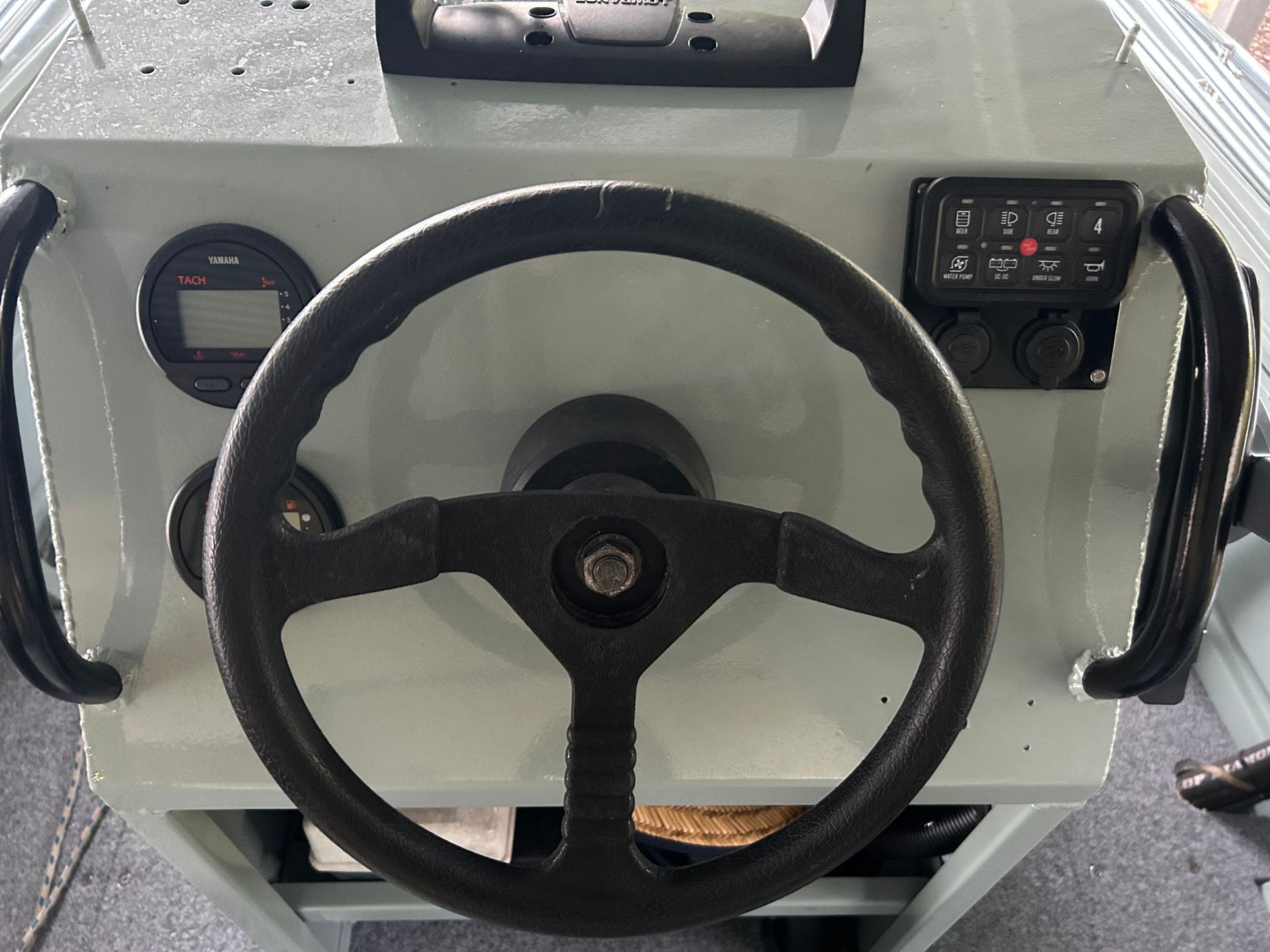 A Person Is Adjusting The Air Conditioner In A Car — REM Auto Electrics In Wallsend, NSW