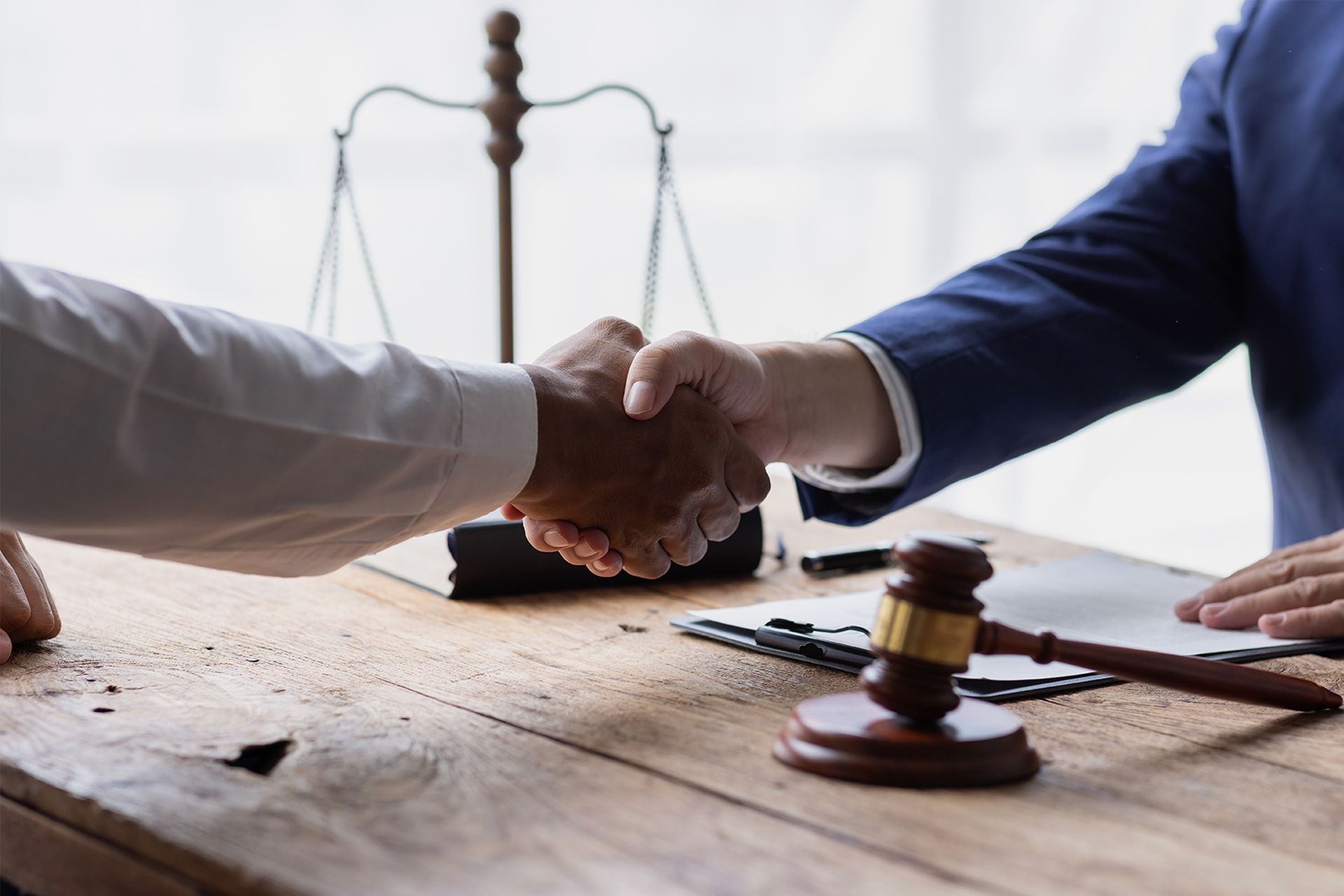 Lawyer and client shaking hands.