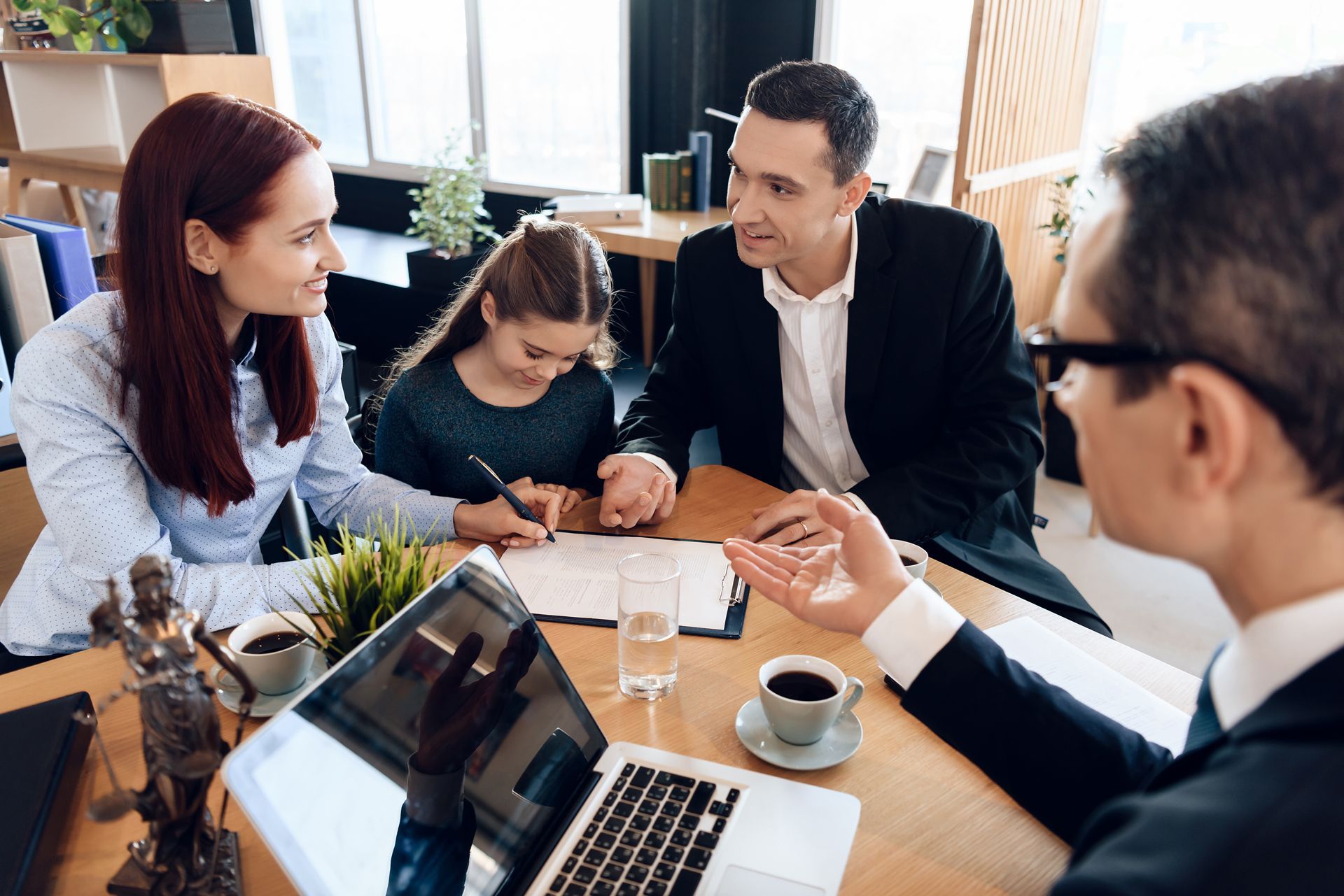 Family with lawyer at a desk