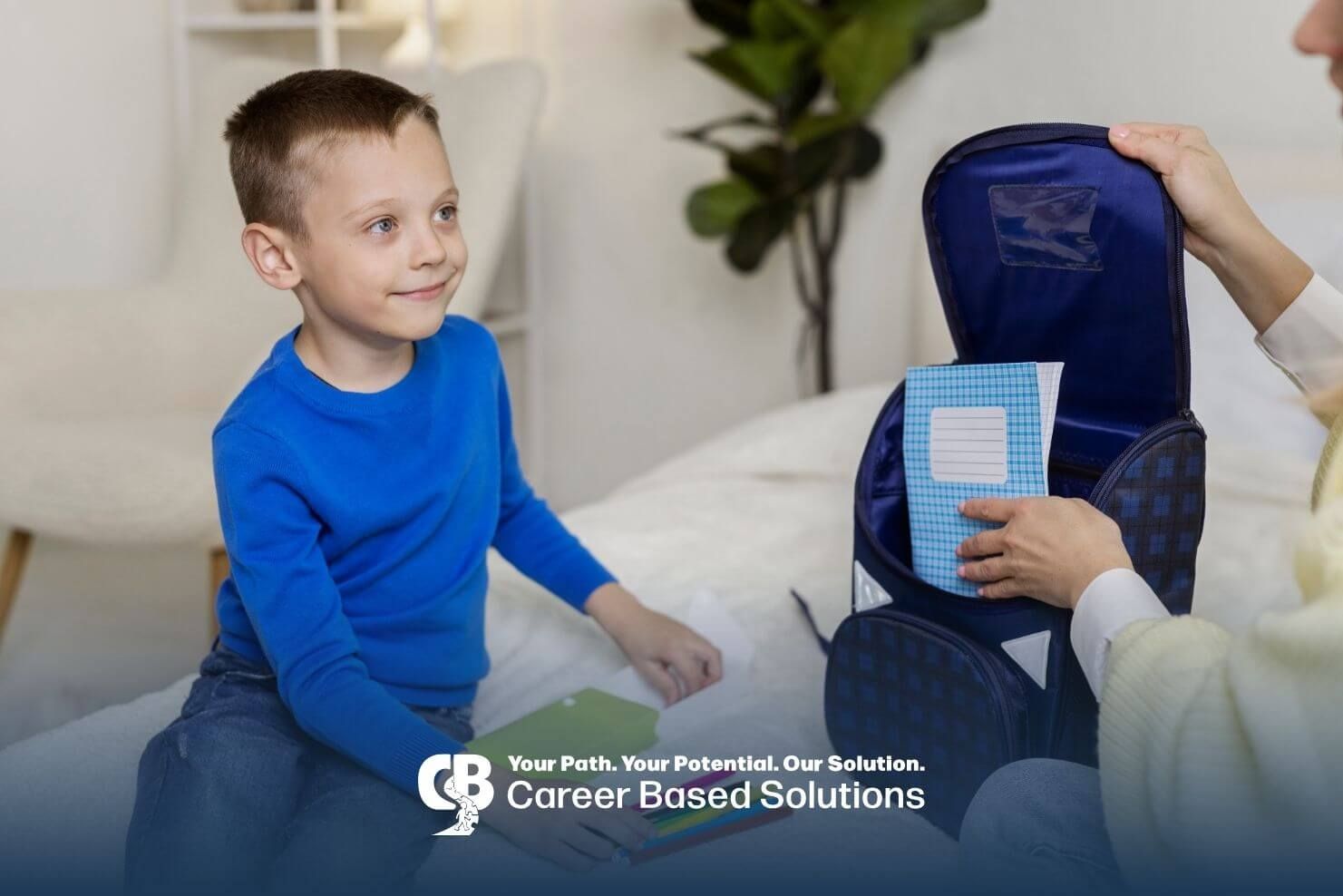 Therapist helping an autistic boy organize school supplies and pack a backpack after ABA therapy