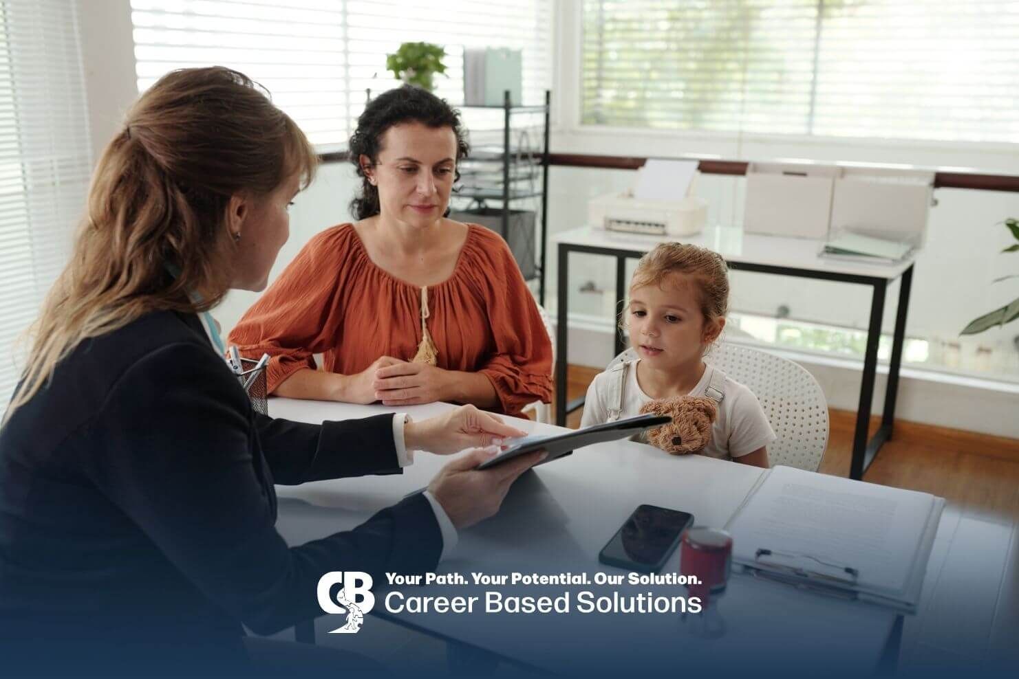 Parent & autistic child meeting with therapist reviewing documents, representing insurance coverage